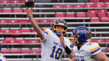 Kenosha St. Joseph quarterback Zach Rizzo (10) throws a pass during the WIAA Division 7 state football championship game against Cochrane-Fountain City at Camp Randall Stadium in Madison on Thursday, Nov. 20, 2025.