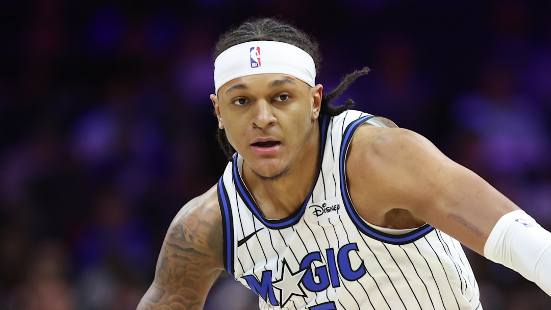 Apr 15, 2026; Philadelphia, Pennsylvania, USA; Orlando Magic forward Paolo Banchero (5) controls the ball against the Philadelphia 76ers during the first quarter during the play-in rounds of the 2026 NBA Playoffs at Xfinity Mobile Arena. Mandatory Credit: Bill Streicher-Imagn Images