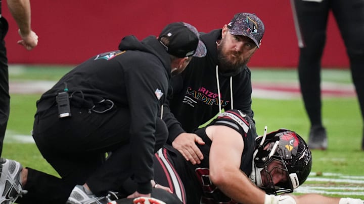 Arizona Cardinals tight end Tip Reiman (87) is tended to before being carted off during their game against the Tennessee Titans at State Farm Stadium in Glendale on Oct. 5, 2025. Arizona Cardinals tight end Tip Reiman (87) is tended to before being carted off during their game against the Tennessee Titans at State Farm Stadium in Glendale on Oct. 5, 2025.