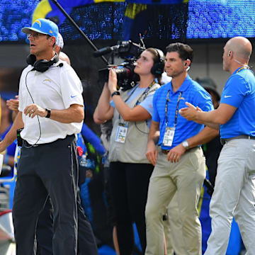 Aug 17, 2024; Inglewood, California, USA; Los Angeles Chargers head coach Jim Harbaugh watches game action against the Los Angeles Rams during the first half at SoFi Stadium. Mandatory Credit: Gary A. Vasquez-Imagn Images