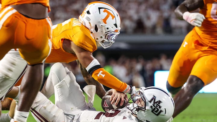 Mississippi State Bulldogs quarterback Blake Shapen (2) is tackled by Tennessee Volunteers defensive back Jalen McMurray (6) during overtime at Davis Wade Stadium at Scott Field. Mississippi State Bulldogs quarterback Blake Shapen (2) is tackled by Tennessee Volunteers defensive back Jalen McMurray (6) during overtime at Davis Wade Stadium at Scott Field.