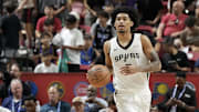 Jul 12, 2025; Las Vegas, NV, USA; San Antonio Spurs guard Dylan Harper (2) dribbles the ball against the Dallas Mavericks in the second quarter of their game at Thomas & Mack Center.
