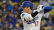 Apr 1, 2025; Los Angeles, California, USA;  Los Angeles Dodgers designated hitter Shohei Ohtani (17) on deck in the first inning against the Atlanta Braves at Dodger Stadium. 