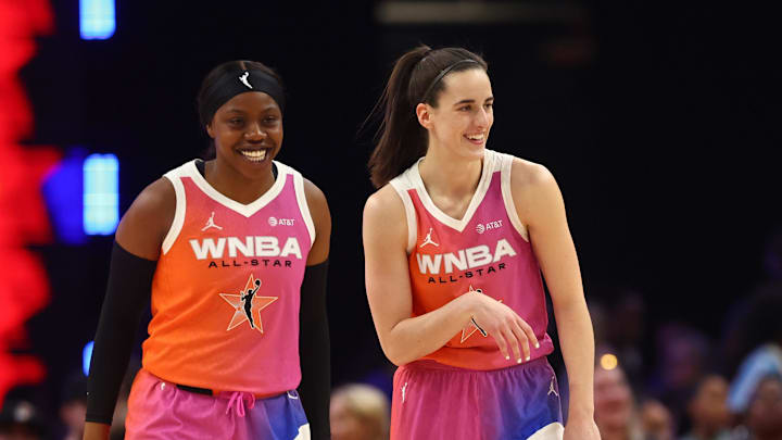 Jul 20, 2024; Phoenix, AZ, USA; Team WNBA guard Caitlin Clark (22) and Team WNBA player Arike Ogunbowale (24) reacts after a play during the first half against the USA Women's National Team at Footprint Center. Mandatory Credit: Mark J. Rebilas-Imagn Images