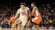 Feb 8, 2025; Minneapolis, Minnesota, USA; Minnesota Golden Gophers guard Lu'Cye Patterson (25) works around Illinois Fighting Illini guard Kylan Boswell (4) during the first half at Williams Arena. Mandatory Credit: Matt Krohn-Imagn Images
