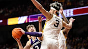 Feb 25, 2025; Minneapolis, Minnesota, USA; Northwestern Wildcats guard Ty Berry (3) shoots the ball as Minnesota Golden Gophers forward Dawson Garcia (3) defends during the second half at Williams Arena. Mandatory Credit: Matt Krohn-Imagn Images