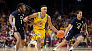 Feb 22, 2025; Minneapolis, Minnesota, USA; Minnesota Golden Gophers guard Isaac Asuma (1) drives towards the basket as Penn State Nittany Lions guard Ace Baldwin Jr. (1) defends during the first half at Williams Arena. Mandatory Credit: Matt Krohn-Imagn Images