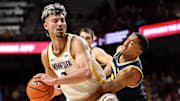 Jan 16, 2025; Minneapolis, Minnesota, USA; Minnesota Golden Gophers forward Dawson Garcia (3) works around Michigan Wolverines guard Nimari Burnett (4) during the first half at Williams Arena. Mandatory Credit: Matt Krohn-Imagn Images