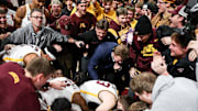 Jan 16, 2025; Minneapolis, Minnesota, USA; Minnesota Golden Gophers players and fans celebrate the teams win after the game against the Michigan Wolverines at Williams Arena. Mandatory Credit: Matt Krohn-Imagn Images
