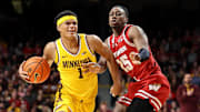 Mar 5, 2025; Minneapolis, Minnesota, USA; Minnesota Golden Gophers guard Isaac Asuma (1) works around Wisconsin Badgers guard John Blackwell (25) during the first half at Williams Arena. Mandatory Credit: Matt Krohn-Imagn Images