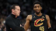 Jan 18, 2025; Minneapolis, Minnesota, USA; Cleveland Cavaliers guard Donovan Mitchell (45) talks with head coach Kenny Atkinson during the second quarter against the Minnesota Timberwolves at Target Center. Mandatory Credit: Matt Krohn-Imagn Images