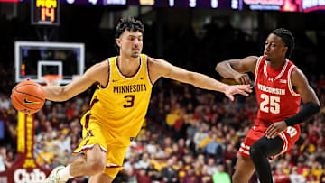 Mar 5, 2025; Minneapolis, Minnesota, USA; Minnesota Golden Gophers forward Dawson Garcia (3) works around Wisconsin Badgers guard John Blackwell (25) during the first half at Williams Arena. Mandatory Credit: Matt Krohn-Imagn Images