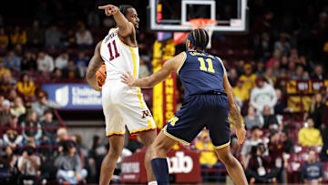 Jan 16, 2025; Minneapolis, Minnesota, USA; Minnesota Golden Gophers guard Femi Odukale (11) gestures as Michigan Wolverines guard Roddy Gayle Jr. (11) defends during the first half at Williams Arena. Mandatory Credit: Matt Krohn-Imagn Images
