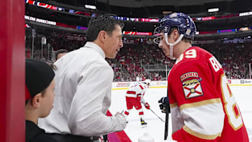 Sep 27, 2023; Raleigh, North Carolina, USA; Carolina Hurricanes head coach Rod Brind   Amour talks to his son Florida Panthers forward Skyler Brind'Amour (89) before the game at PNC Arena. Mandatory Credit: James Guillory-Imagn Images