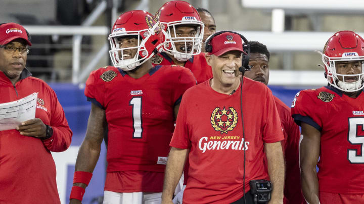 Apr 22, 2022; Birmingham, AL, USA; New Jersey Generals head coach Mike Riley grins as he talks with New Jersey Generals quarterback De'Andre Johnson (1) in the first half at Protective Stadium. Mandatory Credit: Vasha Hunt-USA TODAY Sports