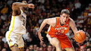 Feb 8, 2025; Minneapolis, Minnesota, USA; Illinois Fighting Illini center Tomislav Ivisic (13) works around Minnesota Golden Gophers guard Femi Odukale (11) during the second half at Williams Arena. Mandatory Credit: Matt Krohn-Imagn Images