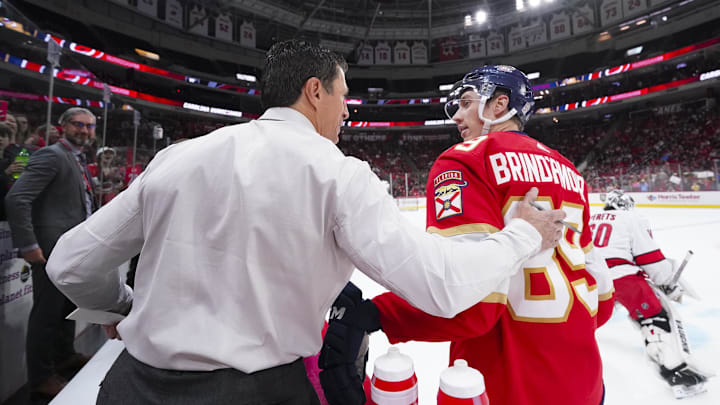 Sep 27, 2023; Raleigh, North Carolina, USA; Carolina Hurricanes head coach Rod Brind   Amour talks to his son Florida Panthers forward Skyler Brind'Amour (89) before the game at PNC Arena. Mandatory Credit: James Guillory-Imagn Images