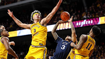 Feb 22, 2025; Minneapolis, Minnesota, USA; Penn State Nittany Lions guard Nick Kern Jr. (3) shoots as Minnesota Golden Gophers forward Dawson Garcia (3) defends during the second half at Williams Arena. Mandatory Credit: Matt Krohn-Imagn Images