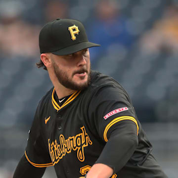 Skenes delivers a pitch. 