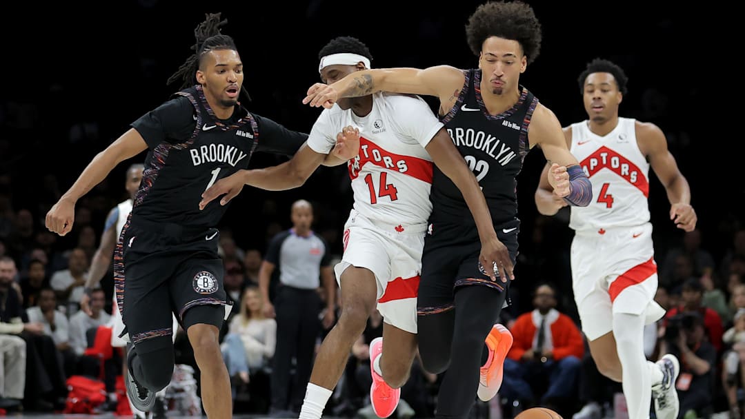 Nov 11, 2025; Brooklyn, New York, USA; Brooklyn Nets forwards Ziaire Williams (1) and Jalen Wilson (22) fight for a loose ball against Toronto Raptors guard Ja'Kobe Walter (14) and forward Scottie Barnes (4) during the first quarter at Barclays Center. Mandatory Credit: Brad Penner-Imagn Images