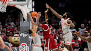 Ohio State forward Devin Royal (left) and guard Evan Mahaffey defend against Nebraska guard Brice Williams during the second overtime Tuesday night.