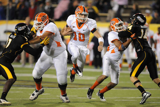 UTEP quarterback Blaire Sullivan finds an opening up the middle as he heads for a first down as they take on Southern Miss.