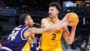 Mar 12, 2025; Indianapolis, IN, USA;  Minnesota Golden Gophers forward Dawson Garcia (3) shoots the ball while Northwestern Wildcats guard K.J. Windham (24) defends in the second half at Gainbridge Fieldhouse. Mandatory Credit: Trevor Ruszkowski-Imagn Images