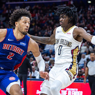 Nov 2, 2023; New Orleans, Louisiana, USA; Detroit Pistons guard Cade Cunningham (2) drives to the basket against New Orleans Pelicans guard Dereon Seabron (0) during the second half at the Smoothie King Center. Mandatory Credit: Stephen Lew-Imagn Images