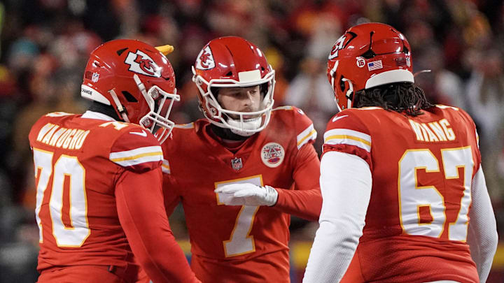 Jan 29, 2023; Kansas City, Missouri, USA; Kansas City Chiefs place kicker Harrison Butker (7) celebrates with offensive tackle Prince Tega Wanogho (70) and offensive tackle Lucas Niang (67) against the Cincinnati Bengals after kicking a field goal during the AFC Championship game at GEHA Field at Arrowhead Stadium. Mandatory Credit: Denny Medley-Imagn Images