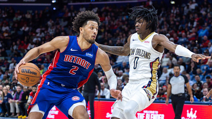 Nov 2, 2023; New Orleans, Louisiana, USA; Detroit Pistons guard Cade Cunningham (2) drives to the basket against New Orleans Pelicans guard Dereon Seabron (0) during the second half at the Smoothie King Center. Mandatory Credit: Stephen Lew-Imagn Images