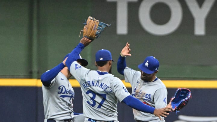 Aug 12, 2024; Milwaukee, Wisconsin, USA; Los Angeles Dodgers outfielder Teoscar Hernández (37), Los Angeles Dodgers outfielder Kevin Kiermaier (93) and Los Angeles Dodgers outfielder Mookie Betts (50) celebrate a 5-2 win over the Milwaukee Brewers at American Family Field. Mandatory Credit: Michael McLoone-USA TODAY Sports