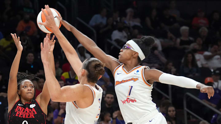 Jun 29, 2022; Phoenix, Arizona, USA; Phoenix Mercury guard Diamond DeShields (1) blocks a shot by Indiana Fever guard Kelsey Mitchell (0) during the second half at Footprint Center. Mandatory Credit: Joe Camporeale-Imagn Images