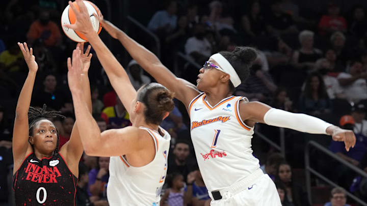 Jun 29, 2022; Phoenix, Arizona, USA; Phoenix Mercury guard Diamond DeShields (1) blocks a shot by Indiana Fever guard Kelsey Mitchell (0) during the second half at Footprint Center. Mandatory Credit: Joe Camporeale-Imagn Images