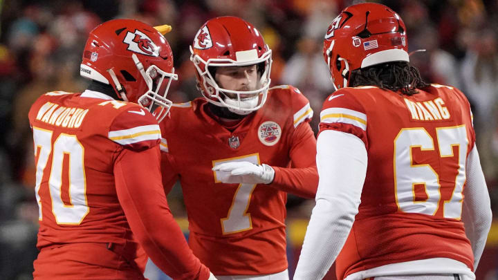 Jan 29, 2023; Kansas City, Missouri, USA; Kansas City Chiefs place kicker Harrison Butker (7) celebrates with offensive tackle Prince Tega Wanogho (70) and offensive tackle Lucas Niang (67) against the Cincinnati Bengals after kicking a field goal during the AFC Championship game at GEHA Field at Arrowhead Stadium. Mandatory Credit: Denny Medley-USA TODAY Sports