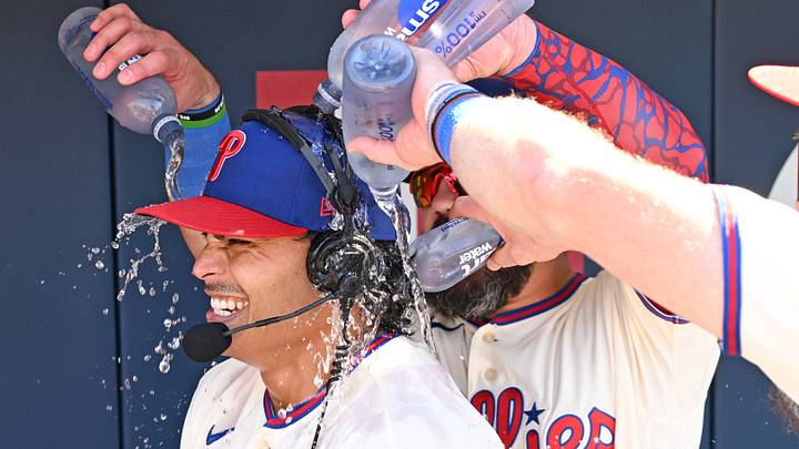Sep 7, 2026; Philadelphia, Pennsylvania, USA; Philadelphia Phillies pitcher Jesús Luzardo (44) is doused with water by designated hitter Kyle Schwarber (12) and left fielder Brandon Marsh (16) after his complete game two-hit shutout against the Atlanta Braves at Citizens Bank Park. Mandatory Credit: Eric Hartline-Imagn Images