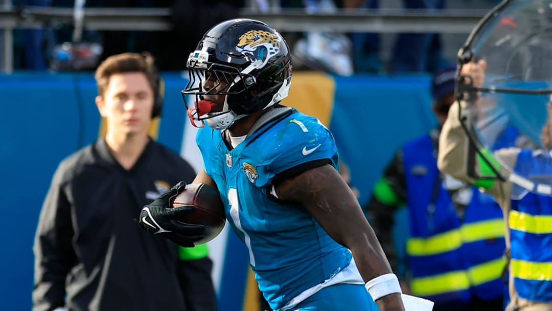 Jacksonville Jaguars running back Travis Etienne Jr. (1) scores a touchdown during the fourth quarter of an NFL football AFC Wild Card playoff matchup, Sunday, Jan. 11, 2026, in Jacksonville, Fla. Jacksonville Jaguars running back Travis Etienne Jr. (1) scores a touchdown during the fourth quarter of an NFL football AFC Wild Card playoff matchup, Sunday, Jan. 11, 2026, in Jacksonville, Fla.