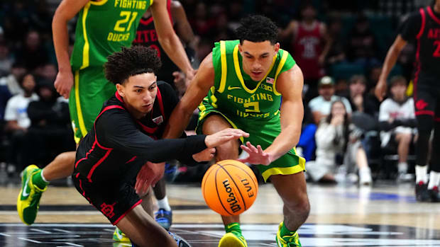 Nov 27, 2024; Las Vegas, Nevada, USA; San Diego State Aztecs guard Miles Byrd (21) and Oregon Ducks guard Jadrian Tracey (2) 