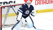 Apr 21, 2025; Winnipeg, Manitoba, CAN; Winnipeg Jets goaltender Connor Hellebuyck (37) warms up before a game against the St. Louis Blues in game two of the first round of the 2025 Stanley Cup Playoffs at Canada Life Centre. Mandatory Credit: James Carey Lauder-Imagn Images