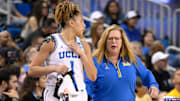 Mar 23, 2025; Los Angeles, California, USA; UCLA Bruins head coach Cori Close with guard Kiki Rice (1) during the second quarter of an NCAA Tournament second round game against the Richmond Spiders at Pauley Pavilion presented by Wescom. Mandatory Credit: Robert Hanashiro-Imagn Images