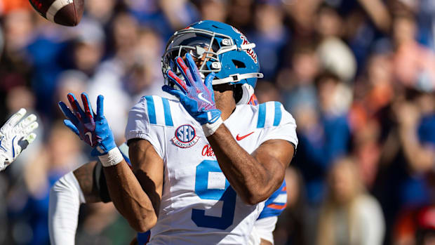 Mississippi Rebels wide receiver Tre Harris makes a catch for a touchdown over Florida Gators defensive back Bryce Thornton. 