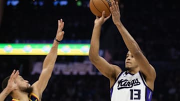 Mar 13, 2025; San Francisco, California, USA; Sacramento Kings forward Keegan Murray (13) shoots over Golden State Warriors guard Stephen Curry (30) during the first quarter at Chase Center. Mandatory Credit: D. Ross Cameron-Imagn Images