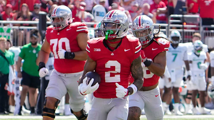 Ohio State receiver Emeka Egbuka runs for a touchdown against Marshall. Ohio State receiver Emeka Egbuka runs for a touchdown against Marshall.