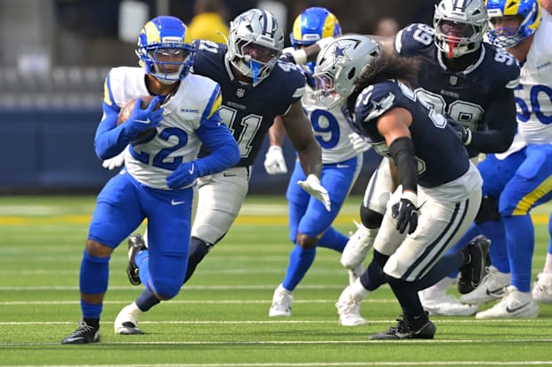 Los Angeles Rams RB Blake Corum pursued by Dallas Cowboys LB Marist Liufau.