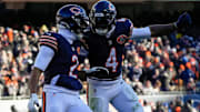 Dec 14, 2025; Chicago, Illinois, USA; Chicago Bears wide receiver DJ Moore (2) and Chicago Bears running back D'Andre Swift (4) celebrate after a touchdown during the third quarter against the Cleveland Browns at Soldier Field. Mandatory Credit: David Banks-Imagn Images
