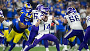 Jan 13, 2025; Glendale, AZ, USA; Minnesota Vikings quarterback Sam Darnold (14) against the Los Angeles Rams during an NFC wild card game at State Farm Stadium. Mandatory Credit: Mark J. Rebilas-Imagn Images