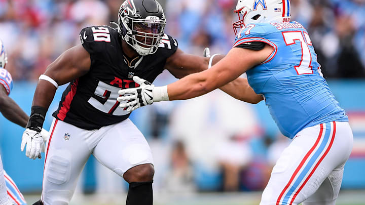 Oct 29, 2023; Nashville, Tennessee, USA;  Atlanta Falcons defensive tackle David Onyemata (90) rushes as Tennessee Titans offensive tackle Peter Skoronski (77) defends during the first half at Nissan Stadium. Mandatory Credit: Steve Roberts-USA TODAY Sports