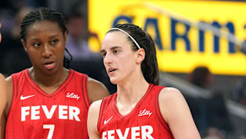 Jun 19, 2025; San Francisco, California, USA; Indiana Fever guard Caitlin Clark (22) talks to guard Lexie Hull (left) and forward Aliyah Boston (7) during the third quarter against the Golden State Valkyries at Chase Center. Mandatory Credit: Darren Yamashita-Imagn Images