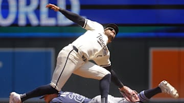 Jul 6, 2025; Minneapolis, Minnesota, USA; Minnesota Twins second baseman Willi Castro (50) tags out Tampa Bay Rays left fielder Jake Mangum (28) on a stolen base attempt in the second inning at Target Field. Mandatory Credit: Bruce Kluckhohn-Imagn Images
