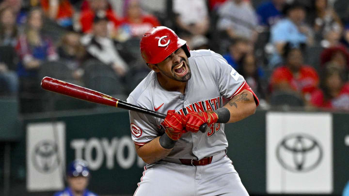 Apr 27, 2024; Arlington, Texas, USA; Cincinnati Reds first baseman Christian Encarnacion-Strand (33) reacts to being hit by a pitch during the second inning against the Texas Rangers at Globe Life Field. Mandatory Credit: Jerome Miron-USA TODAY Sports