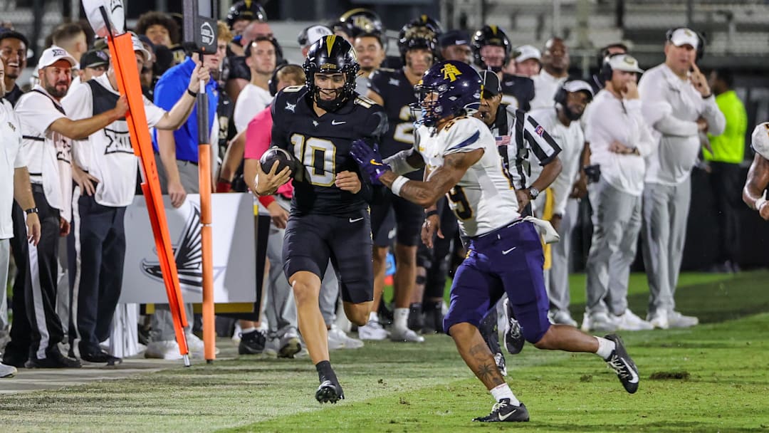 Sep 6, 2025; Orlando, Florida, USA; UCF Knights quarterback Davi Belfort (10) is forced out of bounds by North Carolina A&T Aggies cornerback PeeWee Jones (29) during the second half at Acrisure Bounce House. Mandatory Credit: Mike Watters-Imagn Images